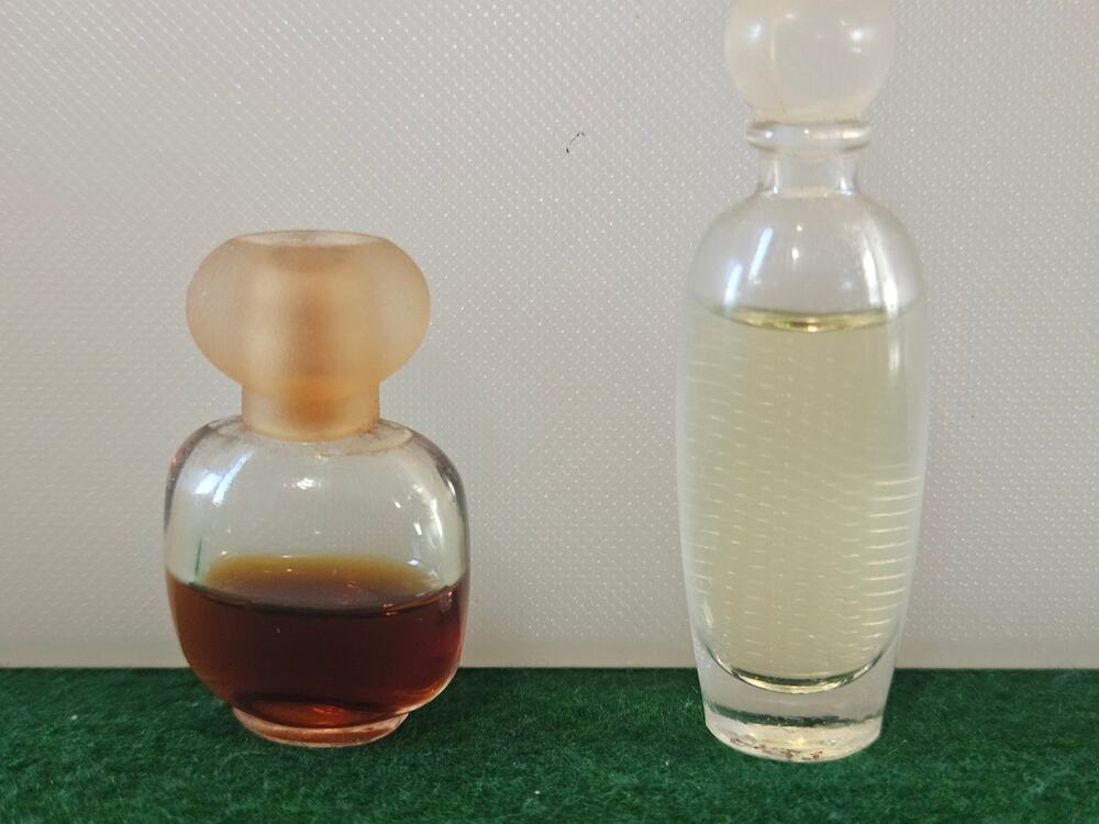 Glass miniature perfume Bottles and one is marked Bodacious Still have perfume